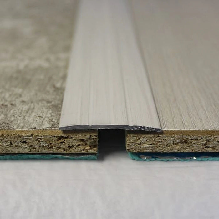 White Wash coverstrip bridging white-toned floors.