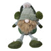 Plush sitting gnome in a green hat with fluffy ear muffs, a long fluffy beard and dangly striped legs