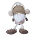 Plush sitting gnome in a knitted taupe hat with cream ear muffs, a white beard and dangly striped legs