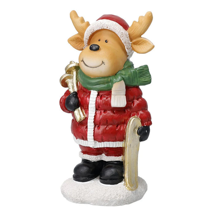 Reindeer figurine in a Santa hat and green scarf with a ski and pole on a snowy base