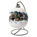 Snowball-shaped village scene with a central Christmas tree and train