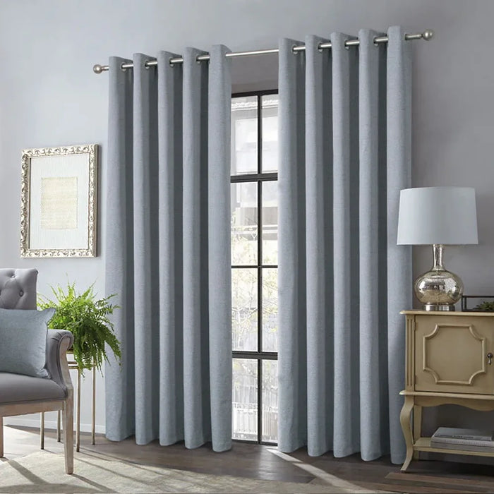 Alva Grey thermal blackout eyelet curtains with interlining, offering insulation, light blocking, and a modern finish.