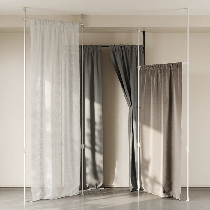 Anywhere expandable white tension curtain pole installed with curtains, showing adjustable no-drill wrap-around design
