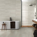 A bathroom wall finished with Barrington Cream tiles, adding warmth and elegance.