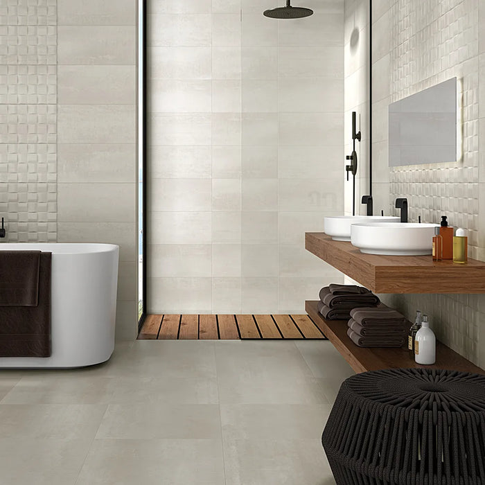 A bathroom floor tiled with Barrington Cream tiles, adding warmth and elegance to the space.