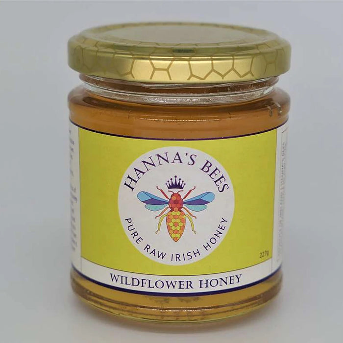 Hanna's Bees Queen Bee gift set with wildflower honey beeswax candle reusable food wraps and flower seeds in a gift box