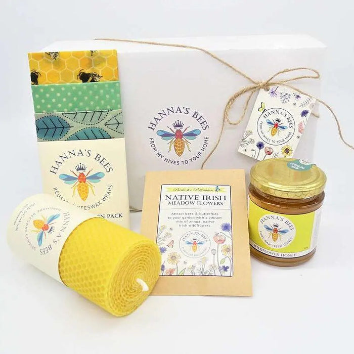 Hanna's Bees Queen Bee gift set with wildflower honey beeswax candle reusable food wraps and flower seeds in a gift box