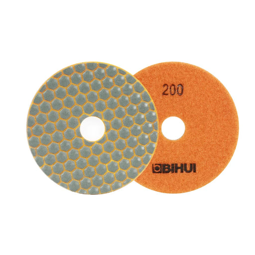 Close-up of the Bihui 4" 200 Grit Dry Diamond Polishing Pad showing its fine-textured surface and light-colored backing for polishing white tiles.