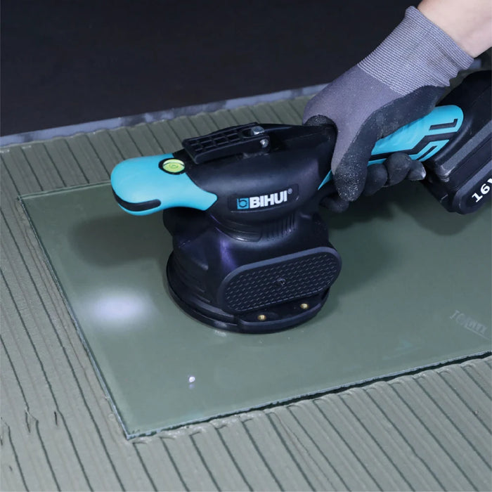 Detail view of the Bihui CVT Vibration Tile Beater showing TPR comfort grip, suction cup base, and integrated level bubble.