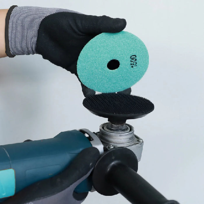 Bihui Rubber Backing Pad shown connected to an angle grinder, ready for use with polishing pads during tile or stone finishing.