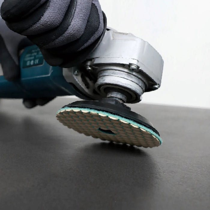 Bihui Rubber Backing Pad shown connected to an angle grinder, ready for use with polishing pads during tile or stone finishing.