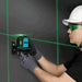 Close-up of the Bihui 12-line self-levelling laser level showing green laser lines and compact, durable housing with bracket mount.