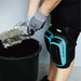 Bihui TKPF Gel Knee Pads placed on a construction site floor with tools and tiles, ready for protective use.