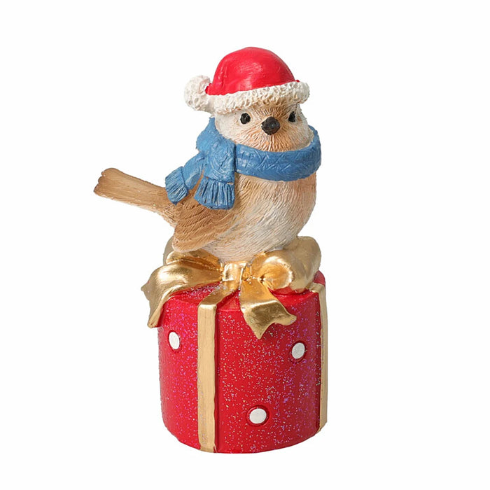Close-up of Bird With Blue Scarf On Giftbox showing detailed blue scarf and decorative giftbox design.