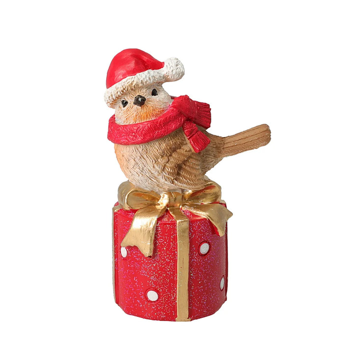 Close-up of Bird With Red Scarf On Giftbox showing red scarf and intricate giftbox pattern.