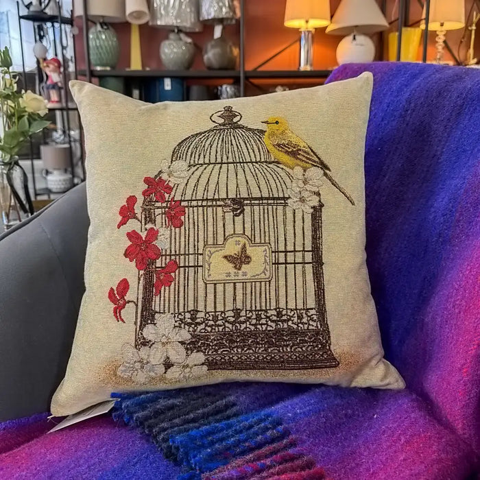 Birds cushion cover styled on a sofa, showing delicate bird.