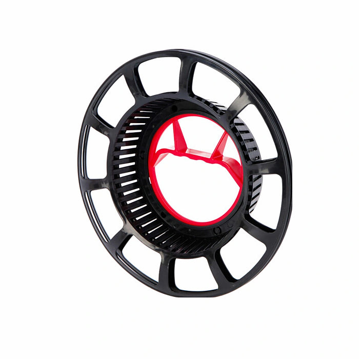 Close-up of black round reel showing coiled Christmas lights.