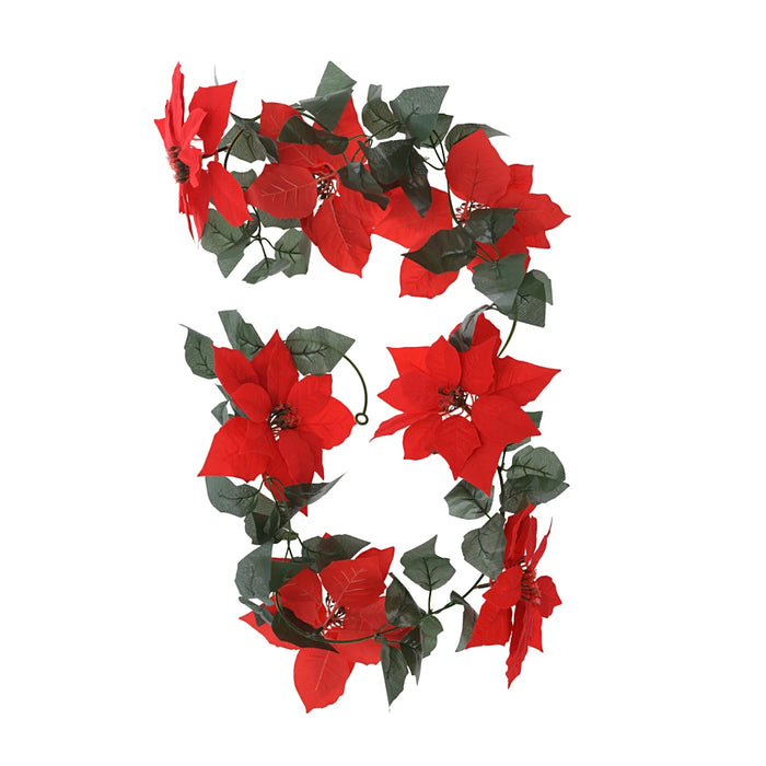 Close-up of red flower garland showing fabric petals and green leaves.