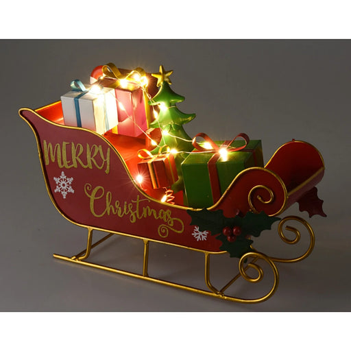 Close-up of Christmas Tree Sleigh showing intricate gift details, Christmas tree, and softly glowing LED lights.
