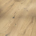 Close-up of Classic 3060 Pure planks showing fine oak grain and a smooth, matt lacquered finish.