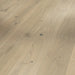 Close-up of Soave White planks showing light oak tones with a gentle whitewashed grain and smooth finish.