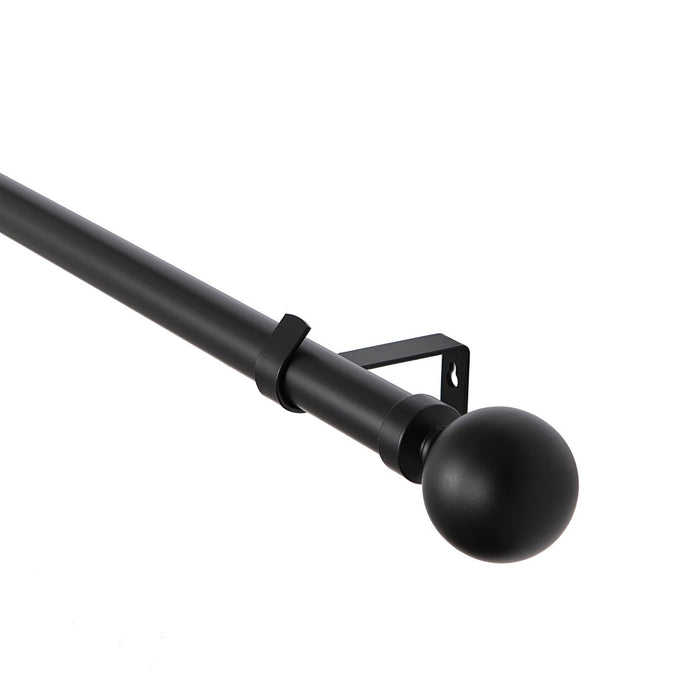 Classic black metal extendable curtain pole with ball caged finials, wall brackets and curtain rings laid out for installation