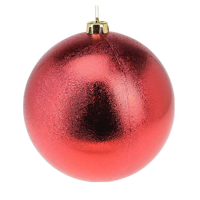 Close-up of dimpled red bauble showing textured glossy finish.