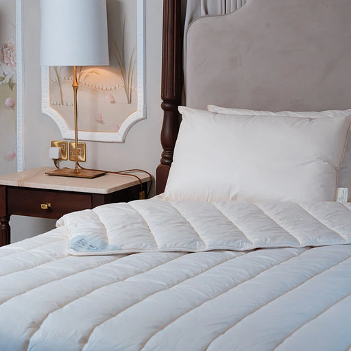 Dooleys Irish Wool All Season Duvet folded on a bed showing natural wool bedding for year round comfort