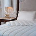 Dooleys Irish Wool All Season Duvet folded on a bed showing natural wool bedding for year round comfort