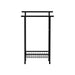 Free standing black towel rail with modern minimalist design in a bathroom