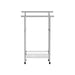 Free standing chrome towel rail with modern minimalist design in a bathroom
