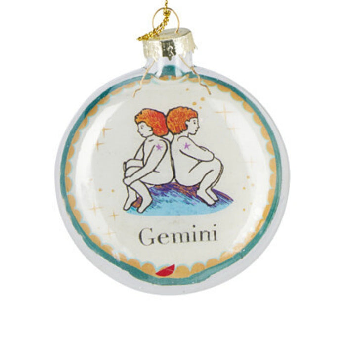 Close-up of Gemini Zodiac Christmas bauble highlighting intricate zodiac detailing and glossy surface.
