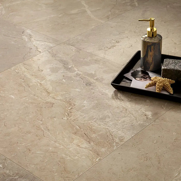 Close-up of Golden Age Beige Porcelain tile, highlighting the intricate marble-inspired veins in golden, beige, and purple hues.