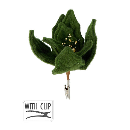 Close-up of green flower ornament showing shimmering petals and attached clip.