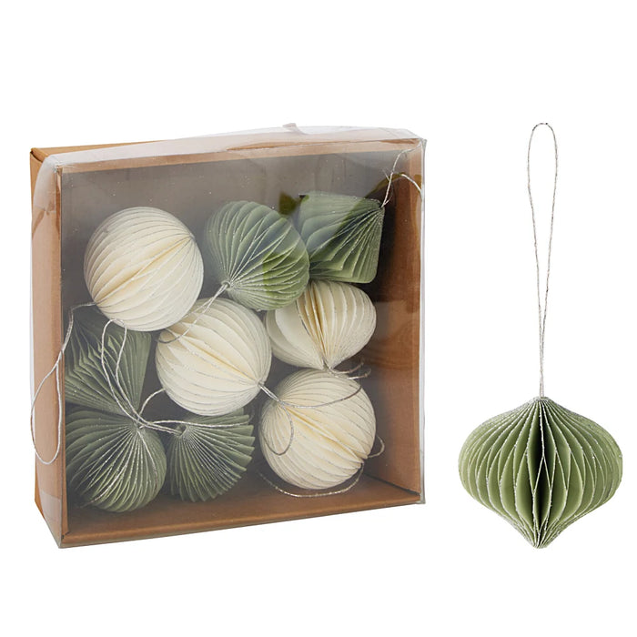Close-up of green and white paper baubles showing layered folds and smooth paper finish.
