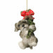 Close-up of Grey & White Dog Hanging From A Garland showing textured fur and colourful garland details.
