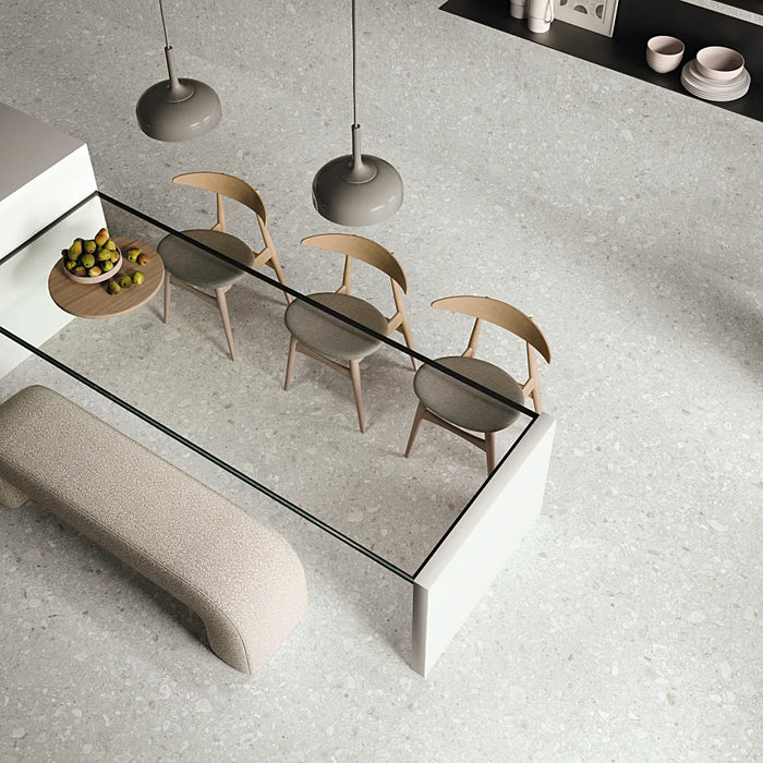 Spacious modern room with Greystone White large-format porcelain tiles, creating a seamless and elegant stone-effect floor.