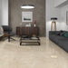 Bright living area with Hamal Sand Polished tiles in a warm beige tone, reflecting light for an elegant finish.