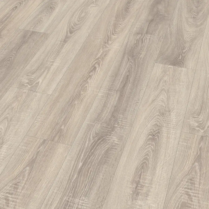 Detailed view of Dawn Oak laminate plank with Deepskin texture, subtle knots, and gentle grain lines in a light grey colour.