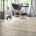 Dawn Oak laminate flooring in a bright interior, showing soft grey tones and natural wood markings for a clean and versatile finish.