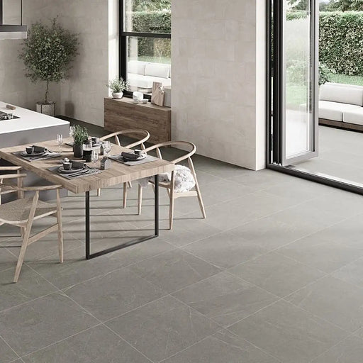 Contemporary living space with Homeful Essentials Grey Matt In Out Porcelain tiles used across indoor flooring and extended outdoors, blending style and functionality.