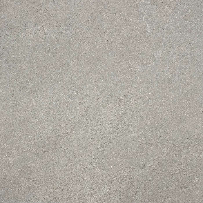Close-up of Homeful Essentials Grey Matt In Out Porcelain tile, showing its soft grey tone, matt texture, and natural surface variation.