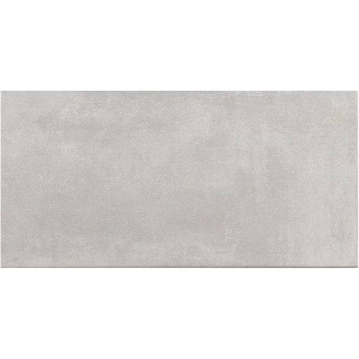 Close-up of Gris wall tile with a smooth grey surface.