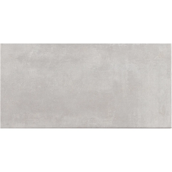 Close-up of Gris wall tile with a smooth grey surface.