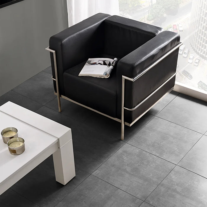 Contemporary living floor with Homeful Essentials Gris Matt 45x45 tiles in a sleek grey tone.