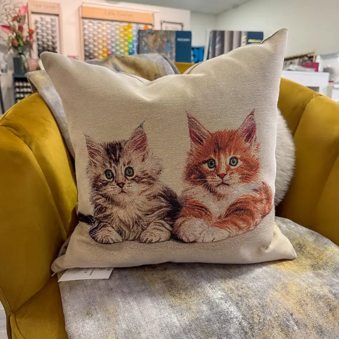 Madison Cats cushion cover styled on a sofa, showing whimsical cat motif in a modern interior.