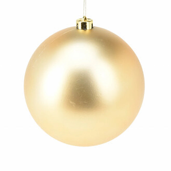 Close-up of matt gold bauble showing smooth satin finish.