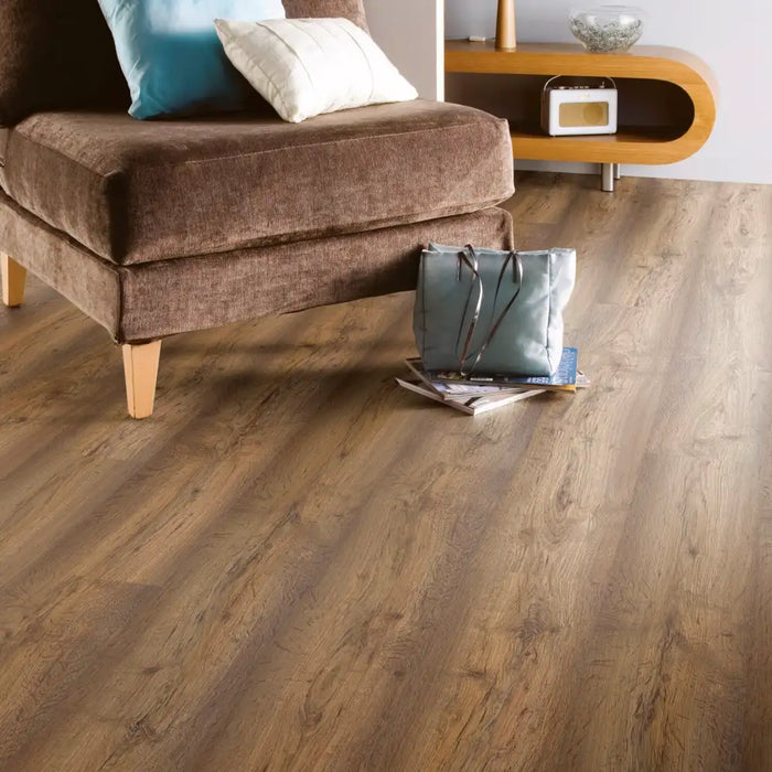 Room setting featuring Modena Oak laminate flooring, enhancing the space with its warm, traditional look.