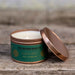 The Moher Soap Co. Irish Coffee scented soy candle handmade in Ireland in a tin beside a coffee mug