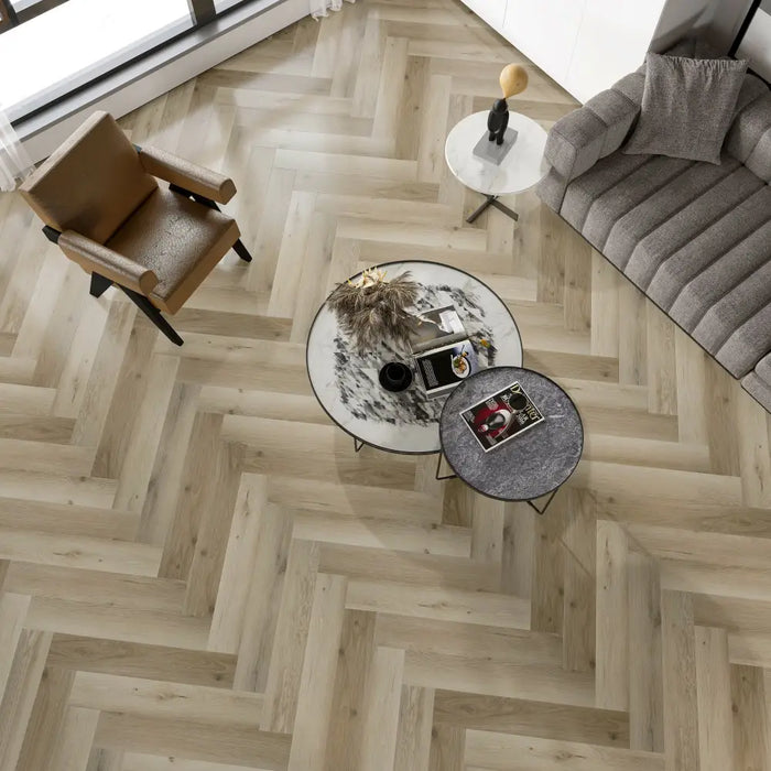 Room setting with Moon 12mm Herringbone laminate flooring, featuring a modern twist on classic herringbone style.